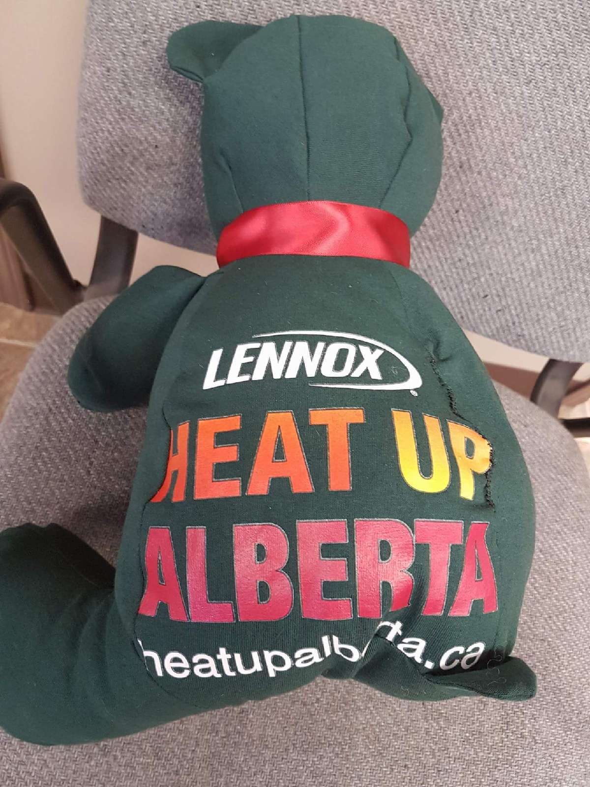 Back of Heat Up Alberta Teddy Bear with the Heat Up Alberta logo displayed